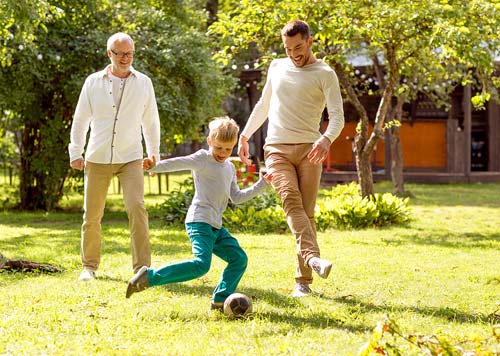 Pain Clinic - family playing football